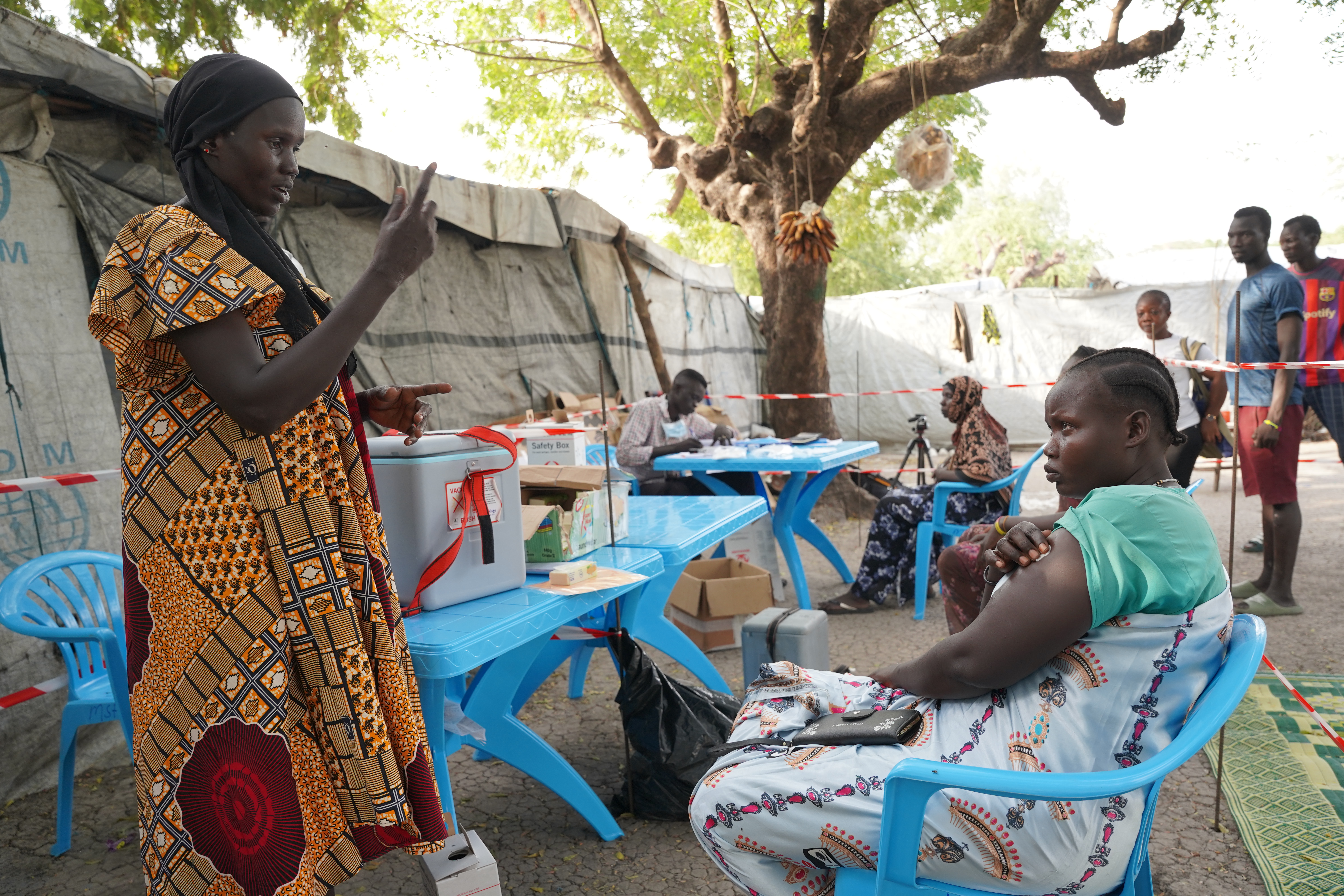 MSF staff interacts with a woman